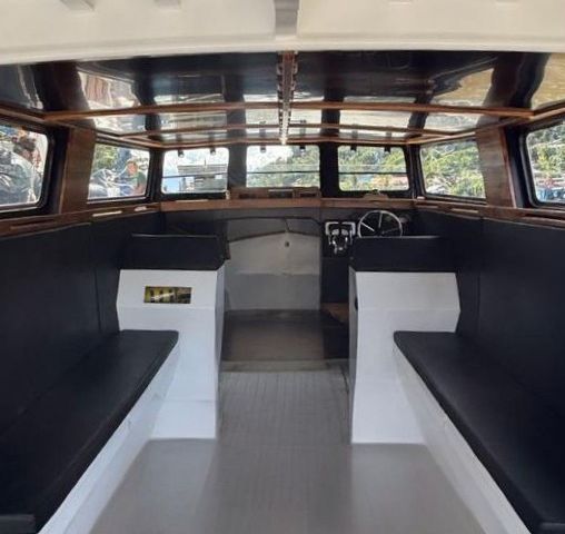 Nyanyi Hujan cabin with bench seating on both sides